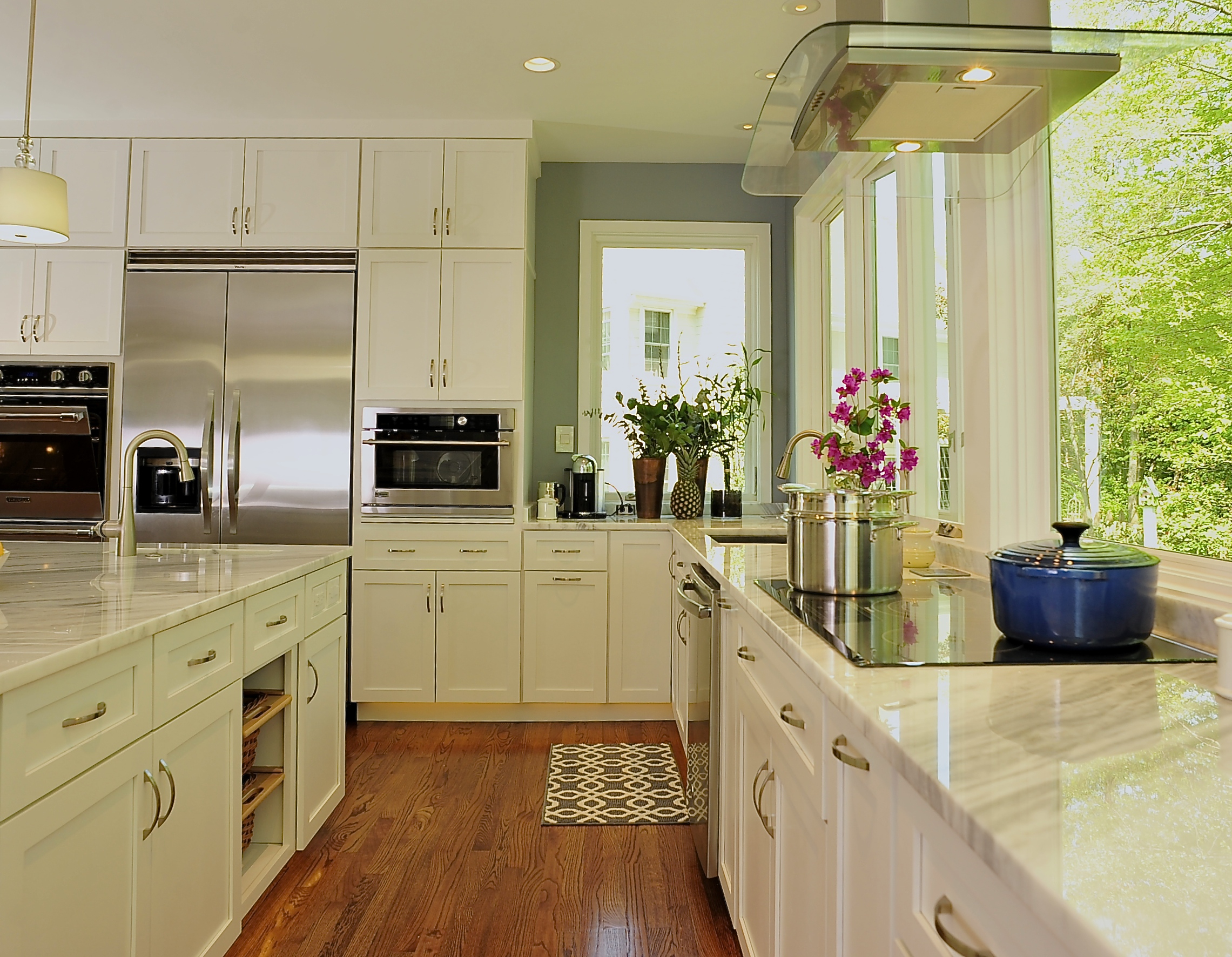 A clean kitchen is designed to be open with a well thought out work triangle and plenty of cabinet storage.